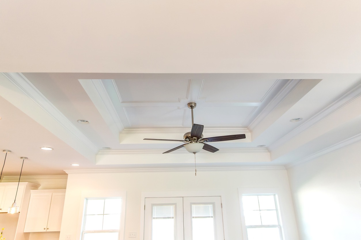 White tray ceiling in small new construction house