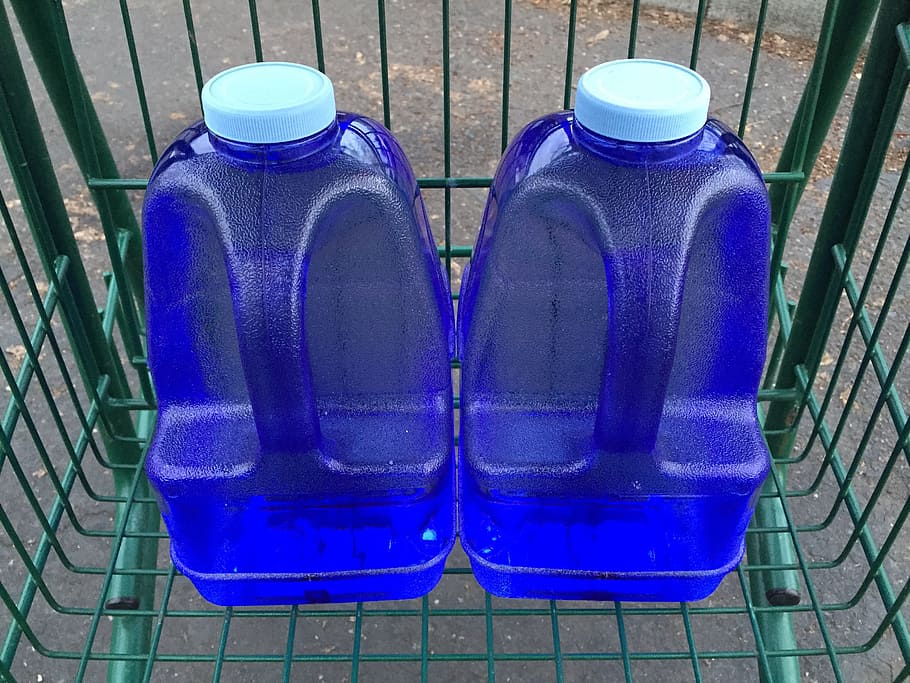 Two blue water containers with drinking water