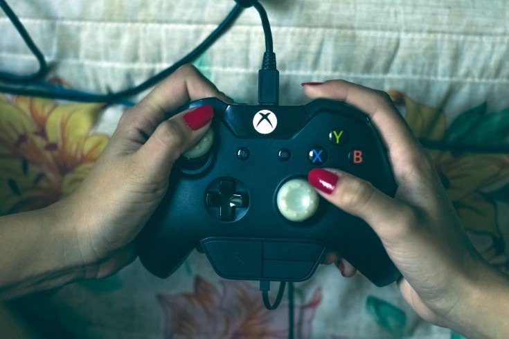 person holding an Xbox controller