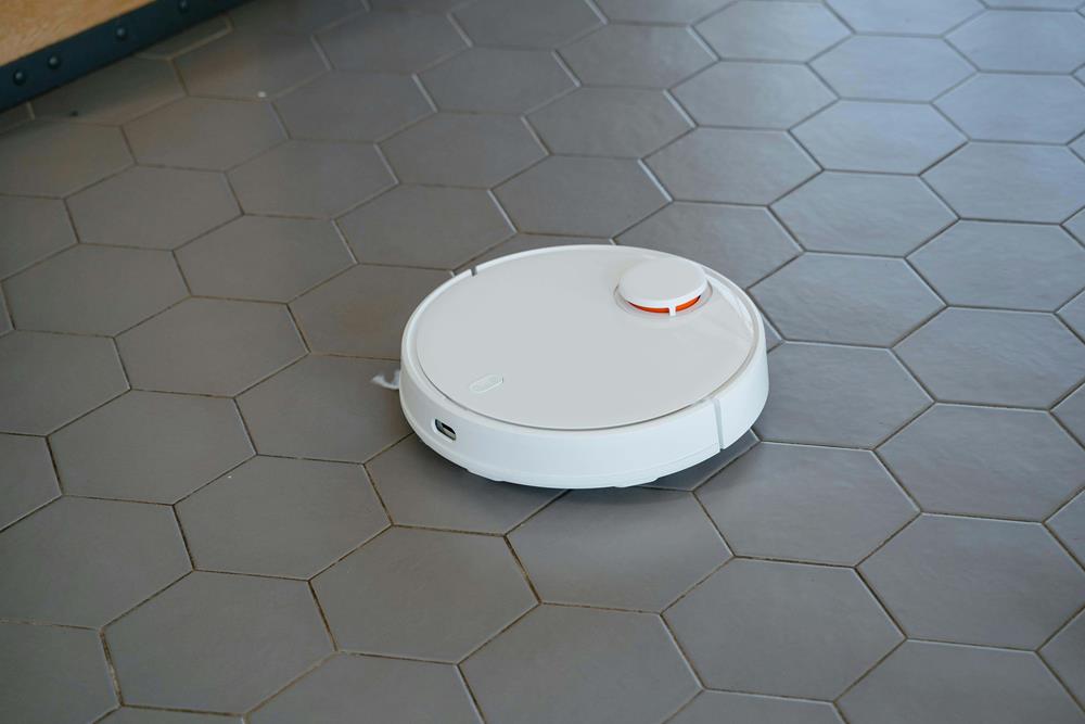 Robot vacuum on a tiled floor