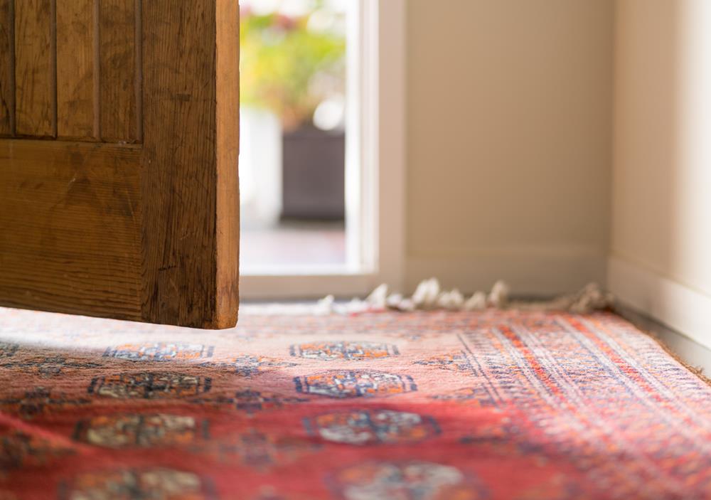 A Persian rug by the door