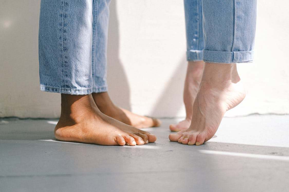 Bare feet on concrete floor