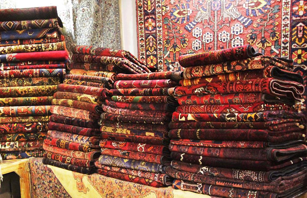 Persian carpets or Iranian carpets also known as Iranian rugs at grand bazaar in Isfahan city, Iran
