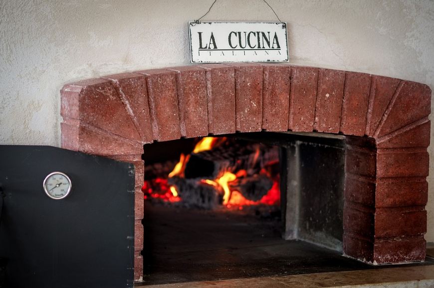 Picture of a lighted-up pizza brick oven