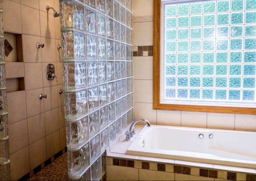 a bathroom with glass block windows
