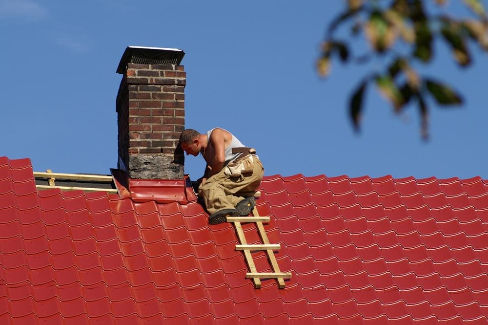 A worker inspecting a chimney