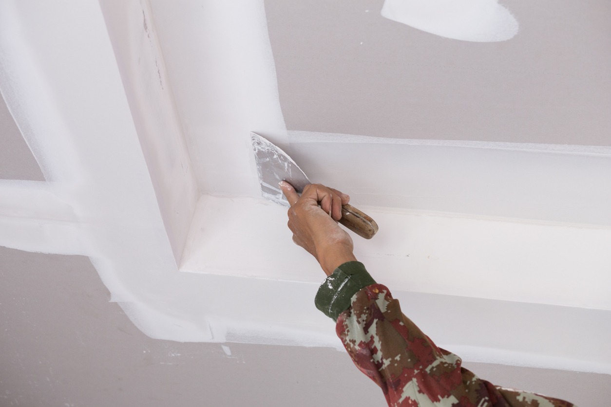applying plaster to the ceiling