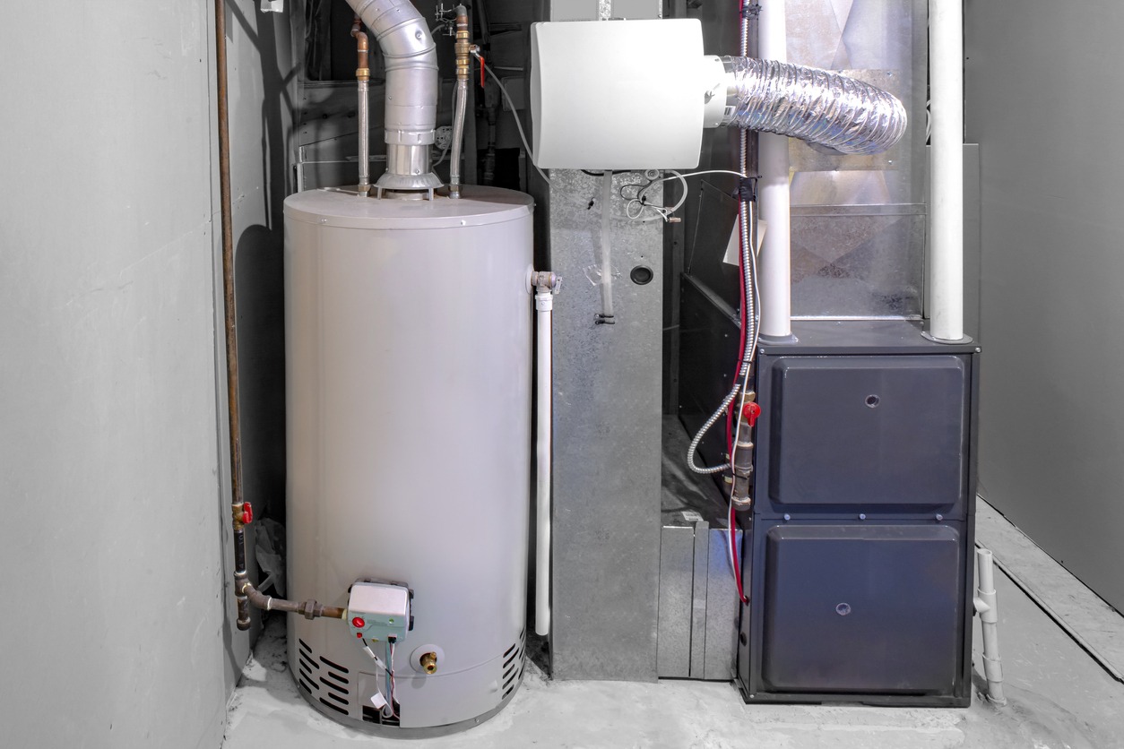 A home high efficiency furnace with a residential gas water heater & humidifier.
