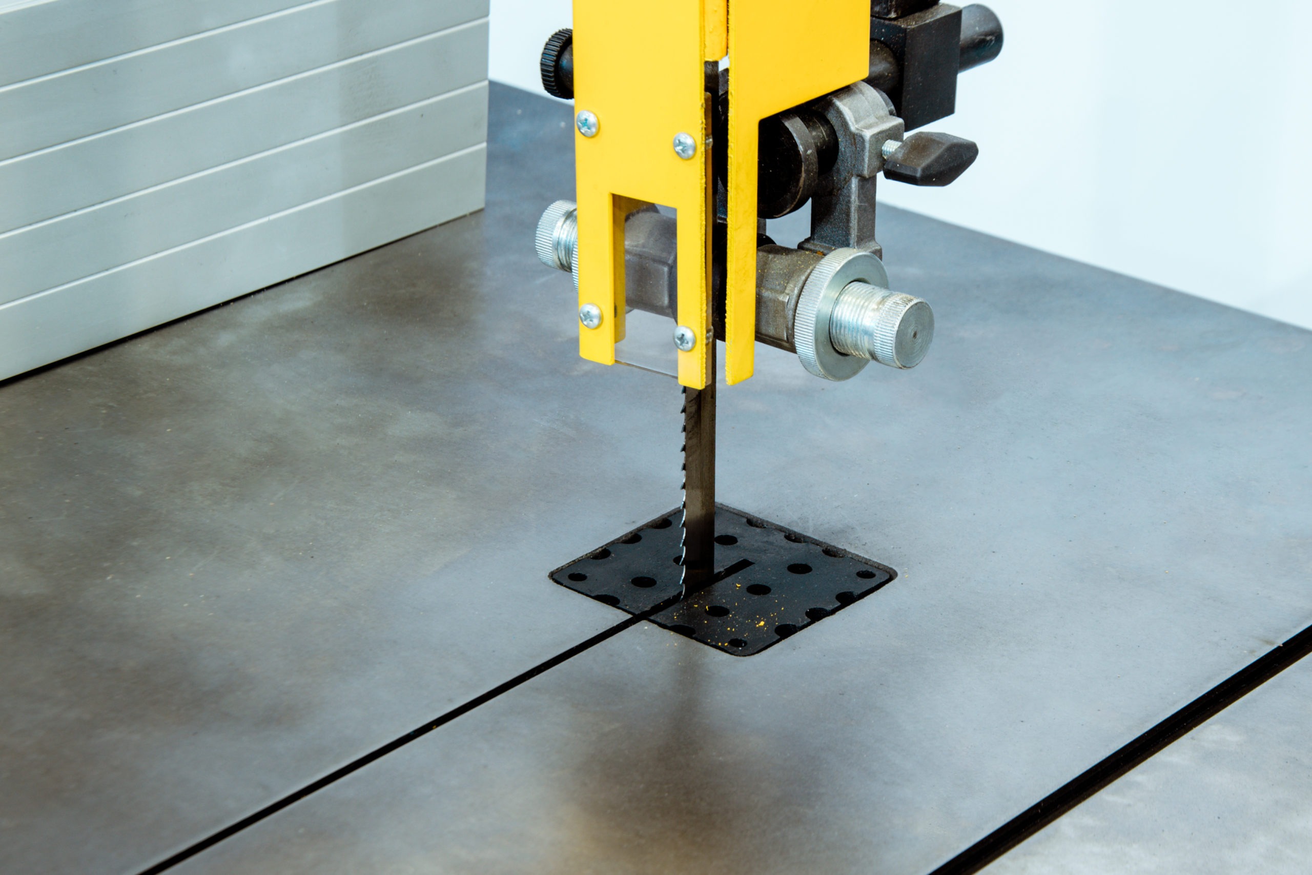 Working table of a vertical band saw.