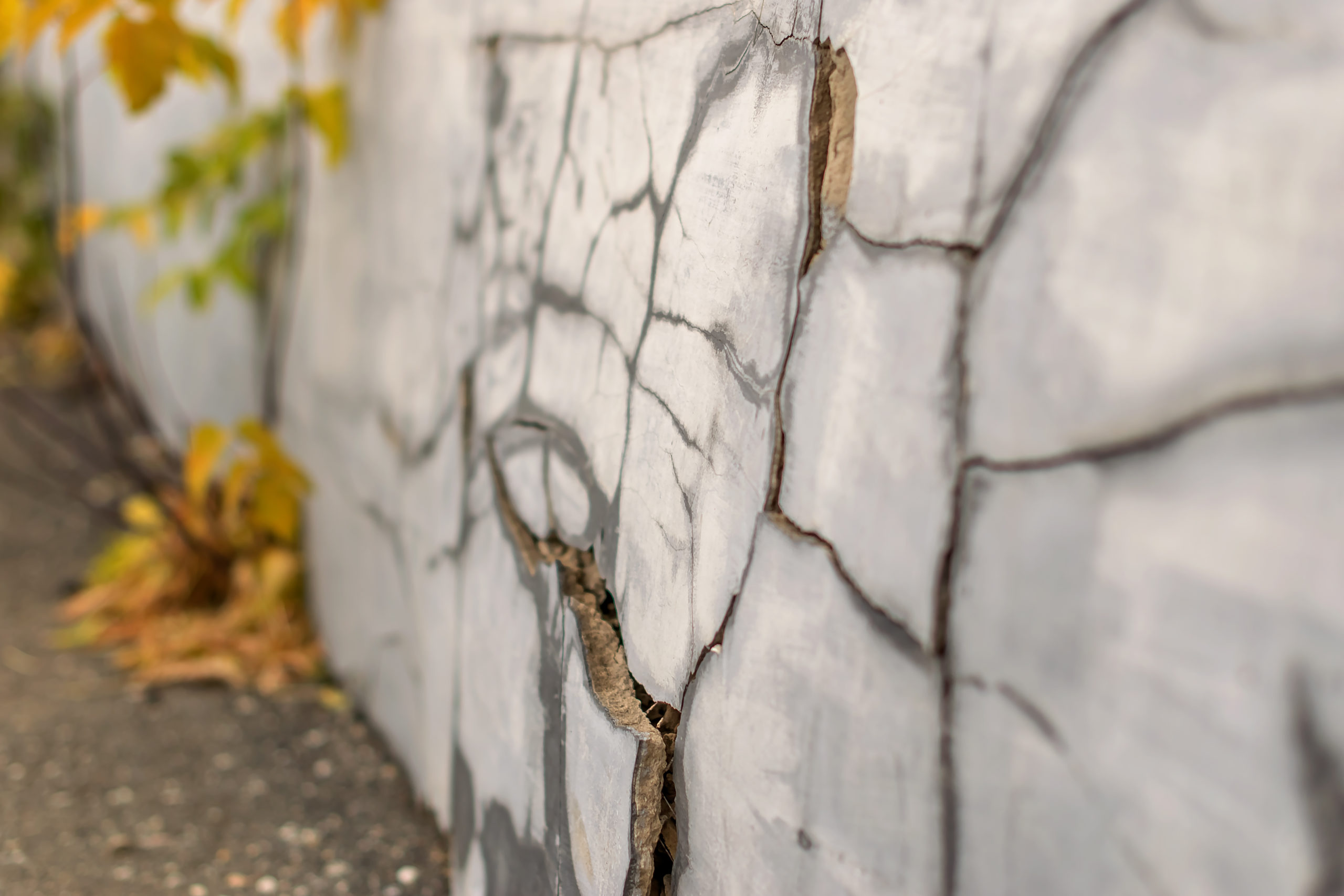 old foundation wall with cracks and chips