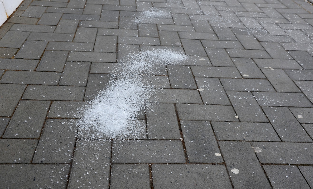 icing protection on the pavement is sprinkled with salt. the salt melts the ice into a harmless slurry. the salt layer is too high. damages concrete paving. salt harms the environment.