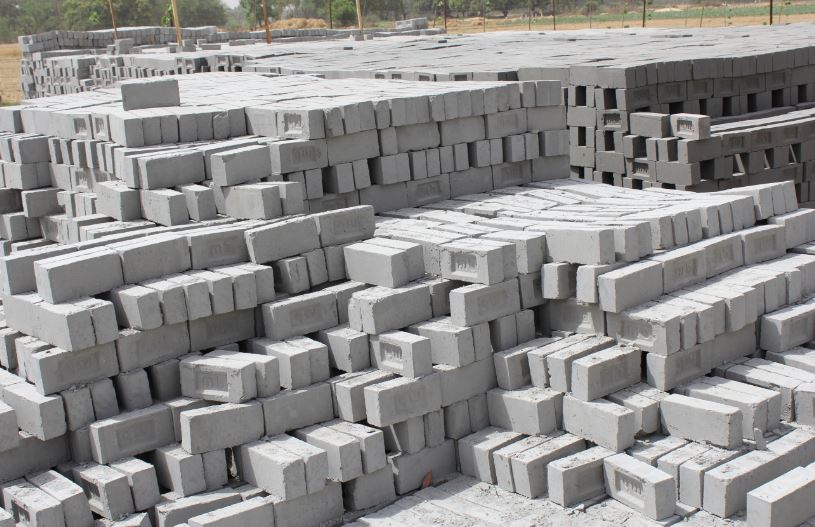 a stack of gray fly ash bricks