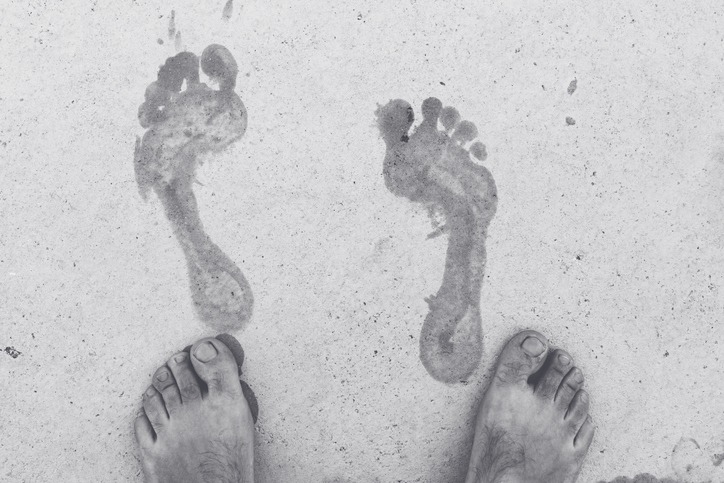 Wet footprints on a concrete slab