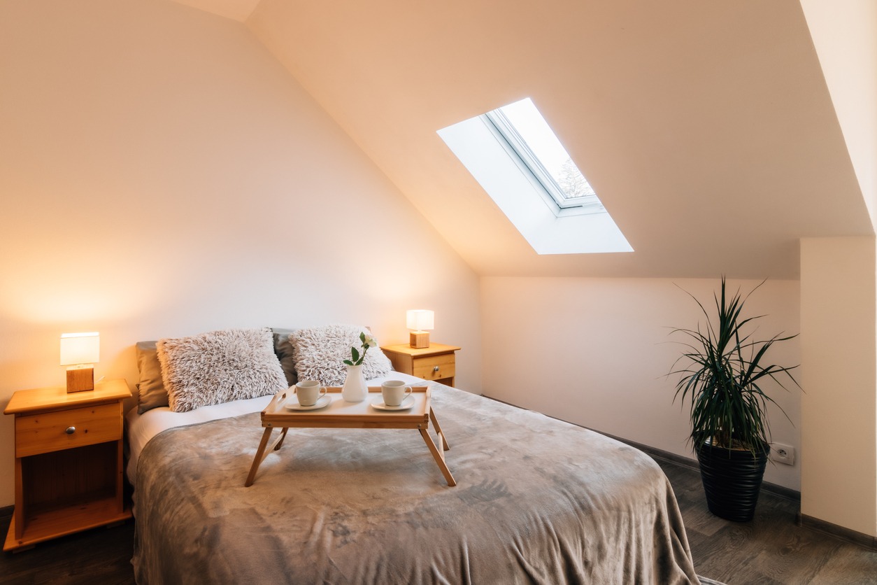 Small attic bedroom with morning breakfast service