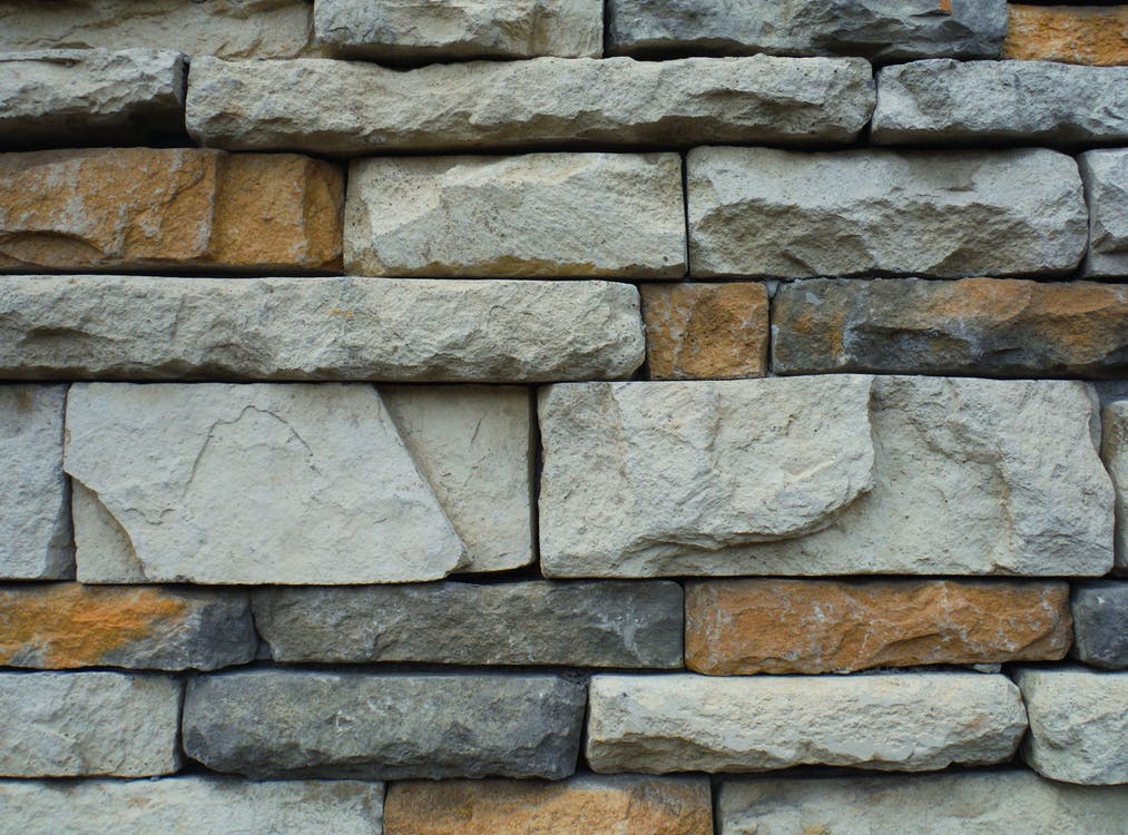 a gray and brown stone wall