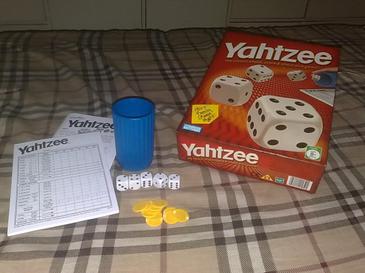 tally sheet, Yahtzee box, dices, and chips