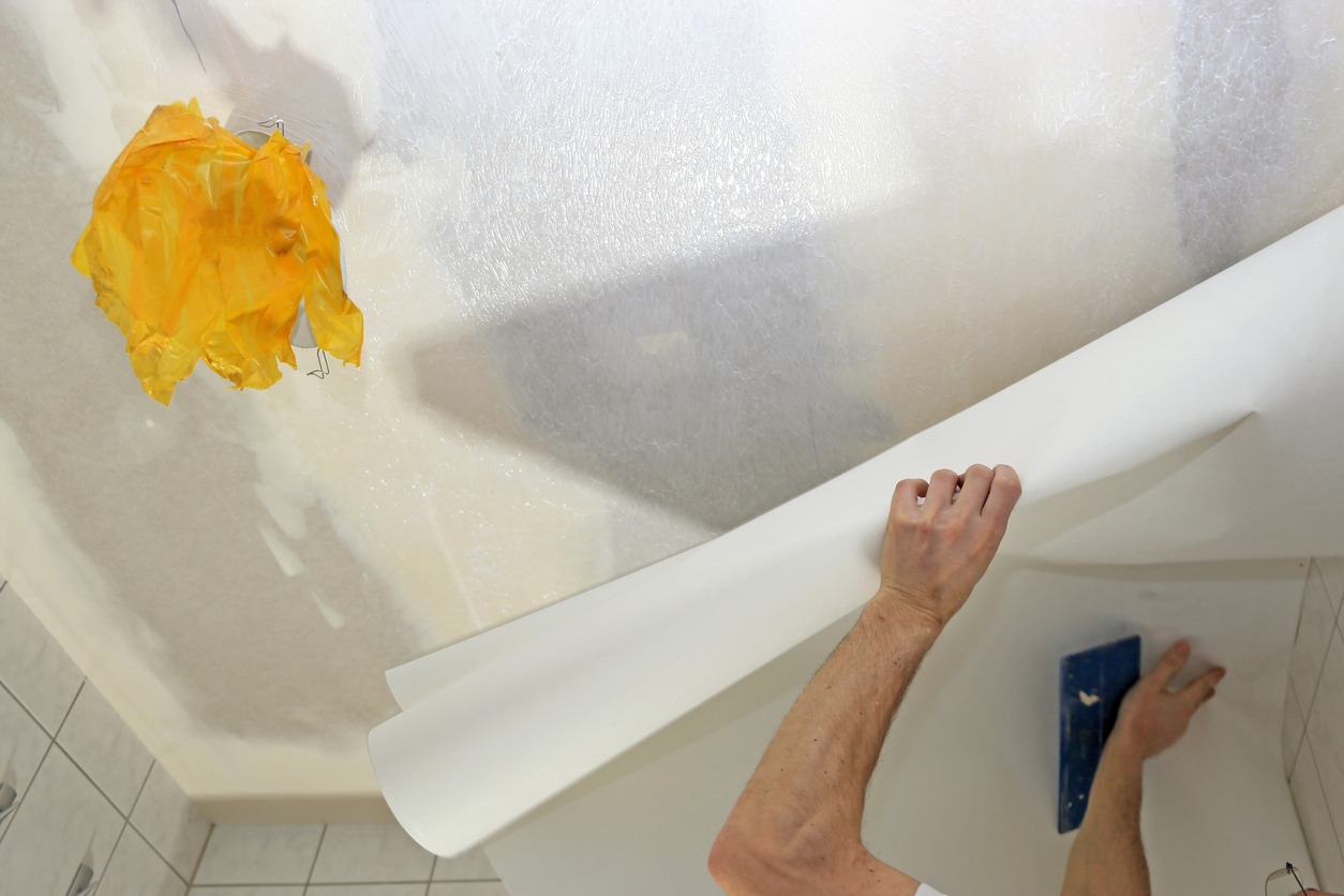 applying wallpaper to the ceiling