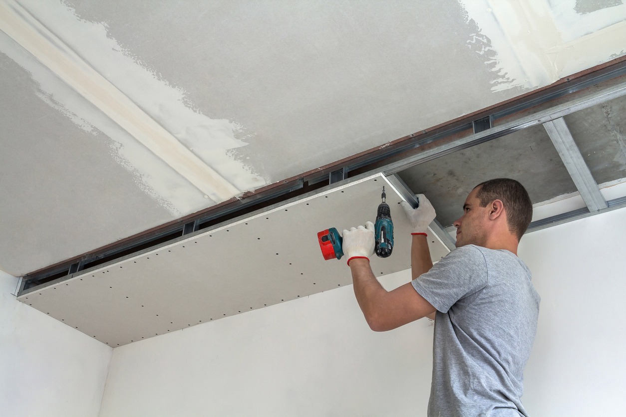 man installing a false ceiling