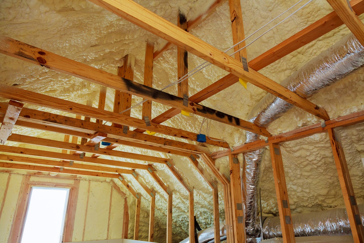 Inside wall insulation in wooden house, building under construction