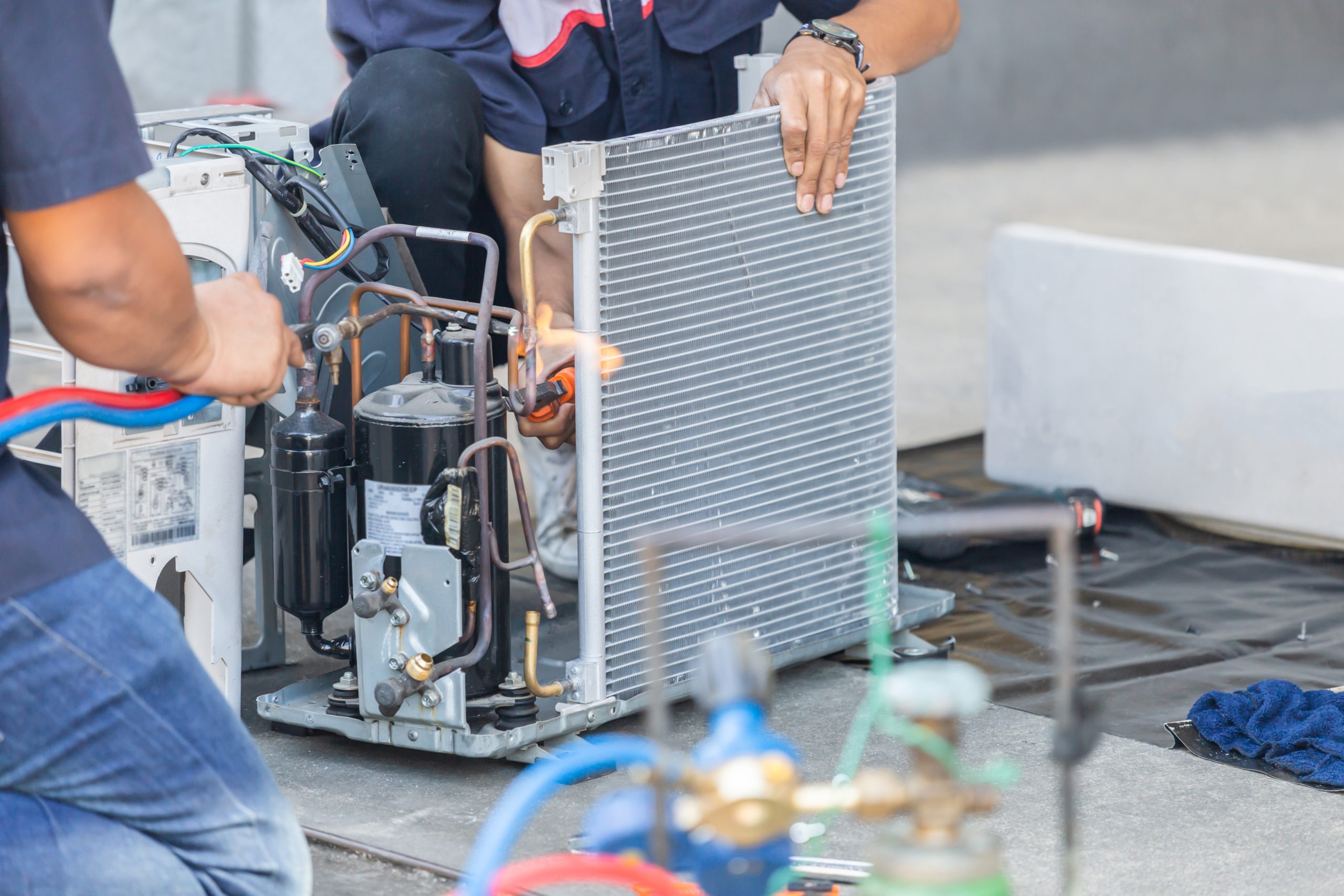 Close up of Air Conditioning Repair team use fuel gases and oxyg