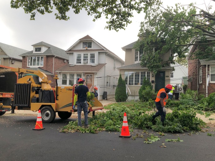 Construction Workers Cleaning up Tree Damage in Queens New York from Tropical Storm Isaias
