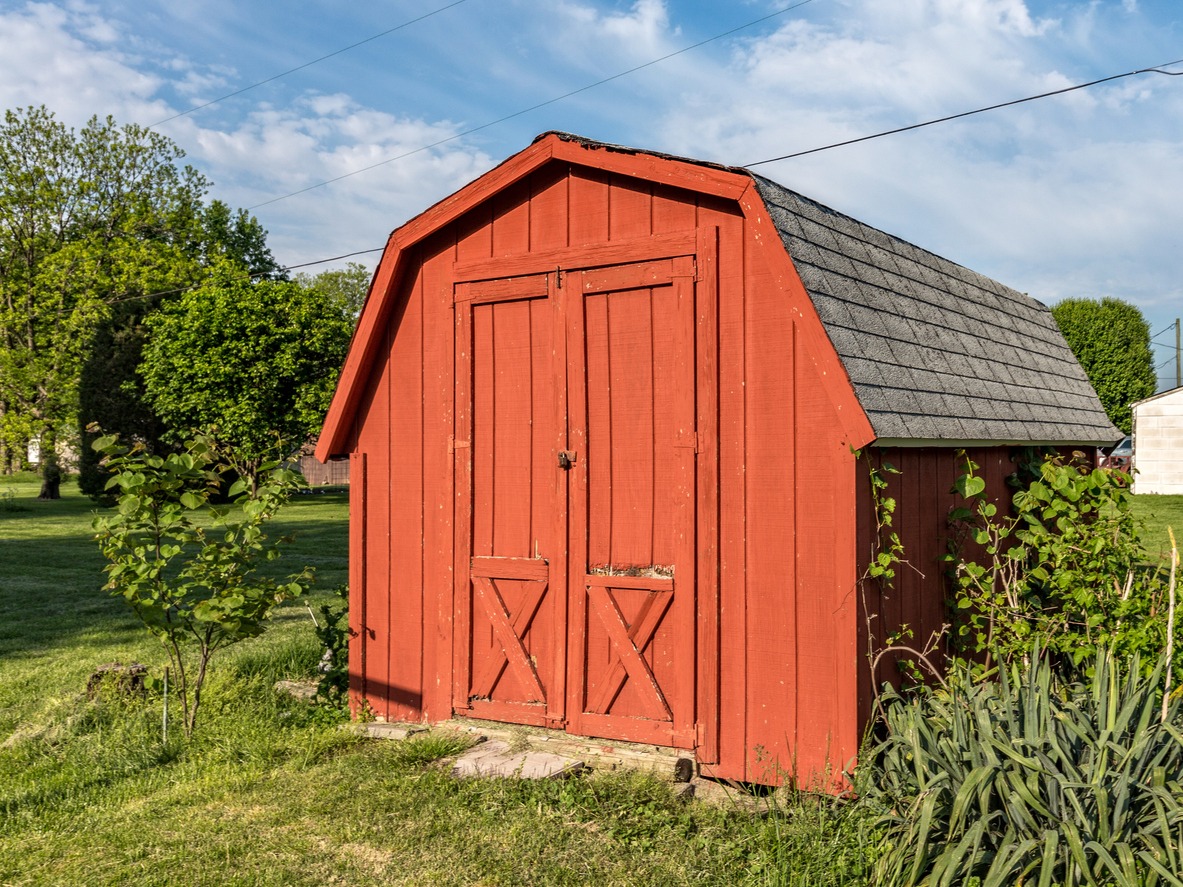 a red gambrel shed