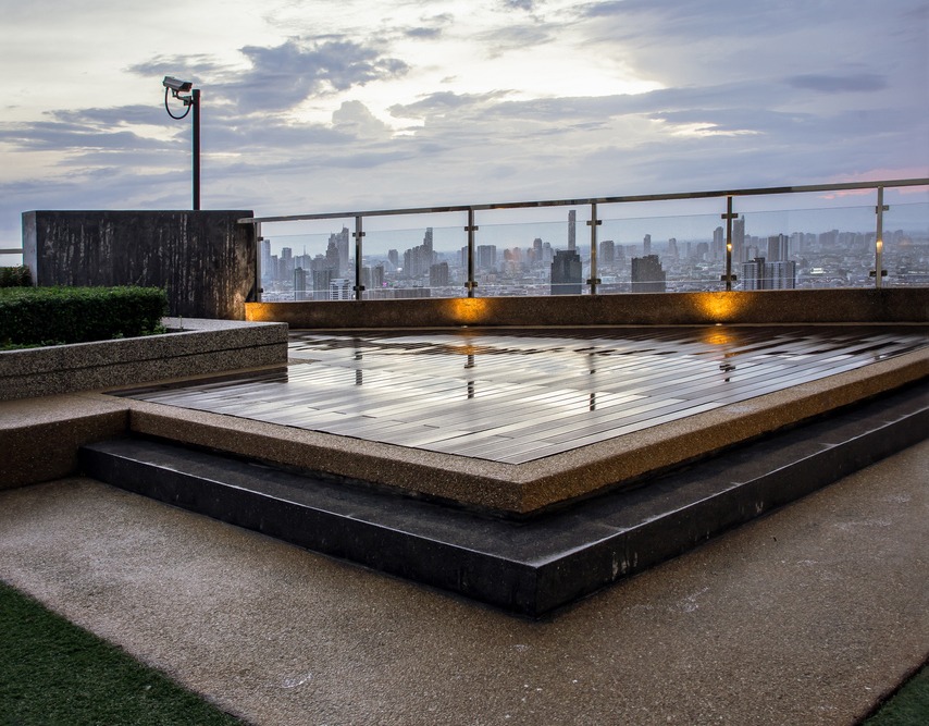 a beautiful rooftop deck with the city skyline view