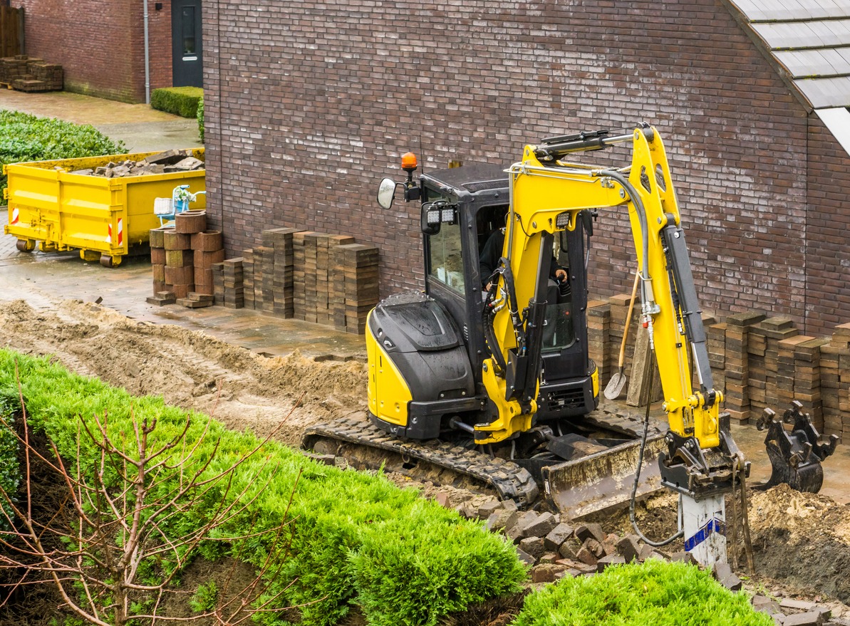 a machinery digging in the garden