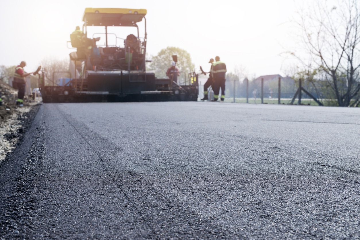 coating the road with asphalt concrete