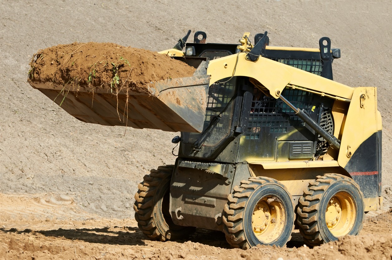 earth-moving using a skid steer loader