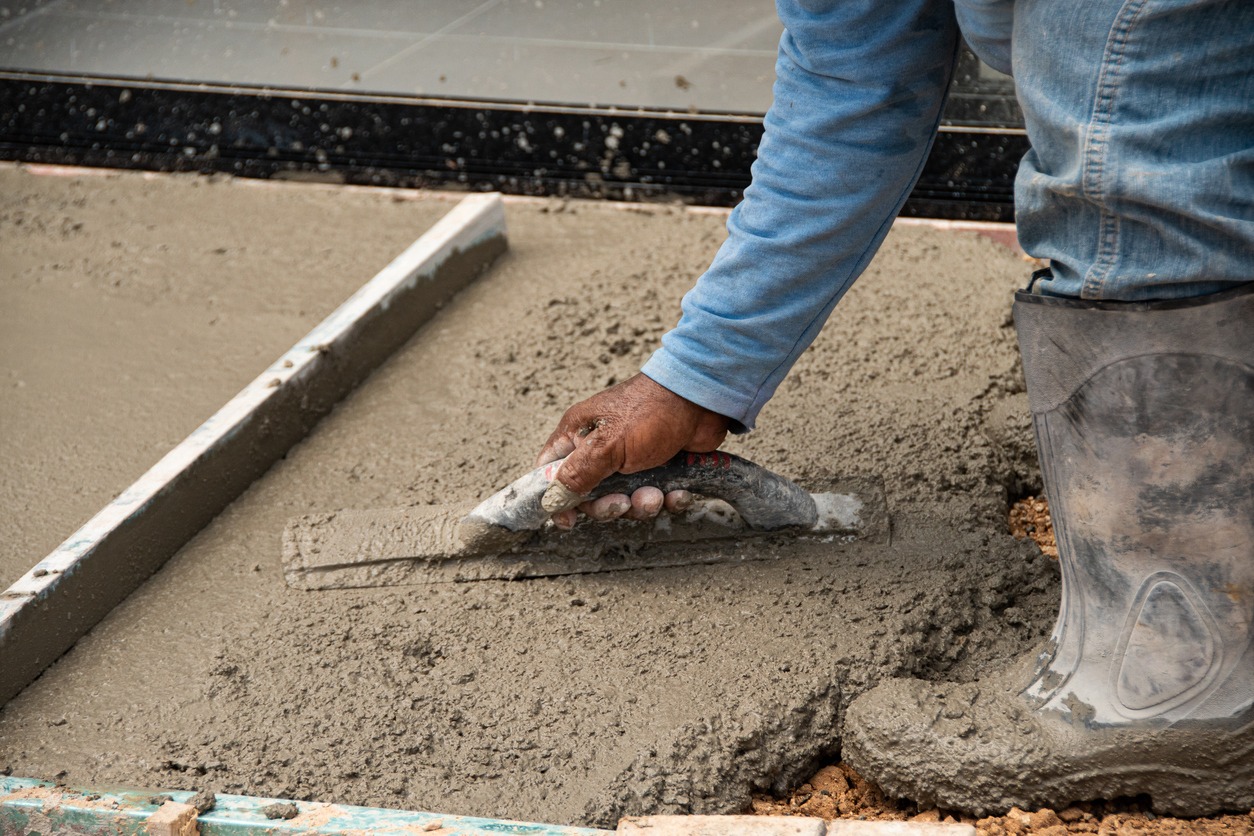 man making concrete flooring