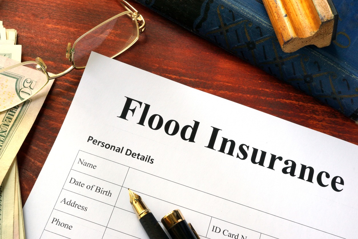 a flood insurance form on the table