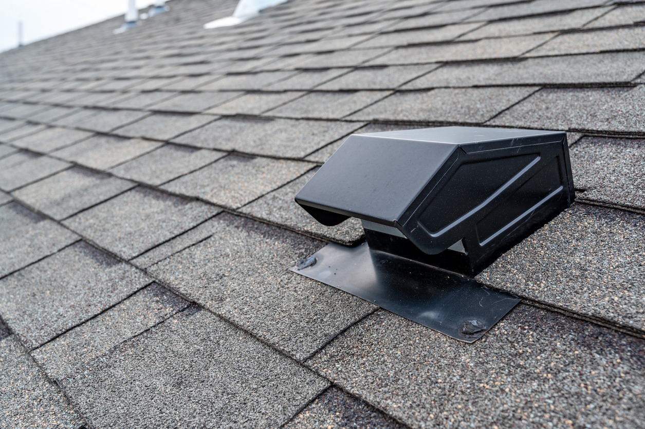 static vent installed on a shingle roof for attic ventilation