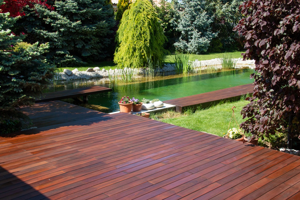 A garden backyard with wooden deck made of Ipe and Cumaru woods