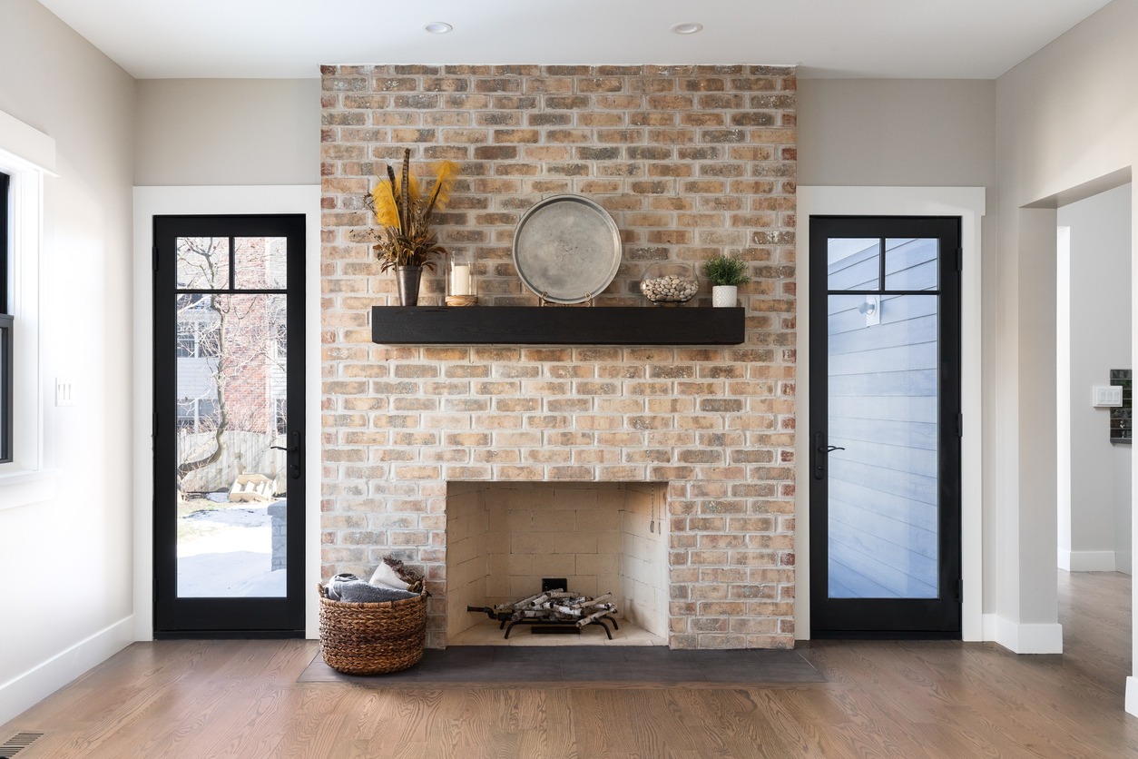 a modern house with a brick fireplace