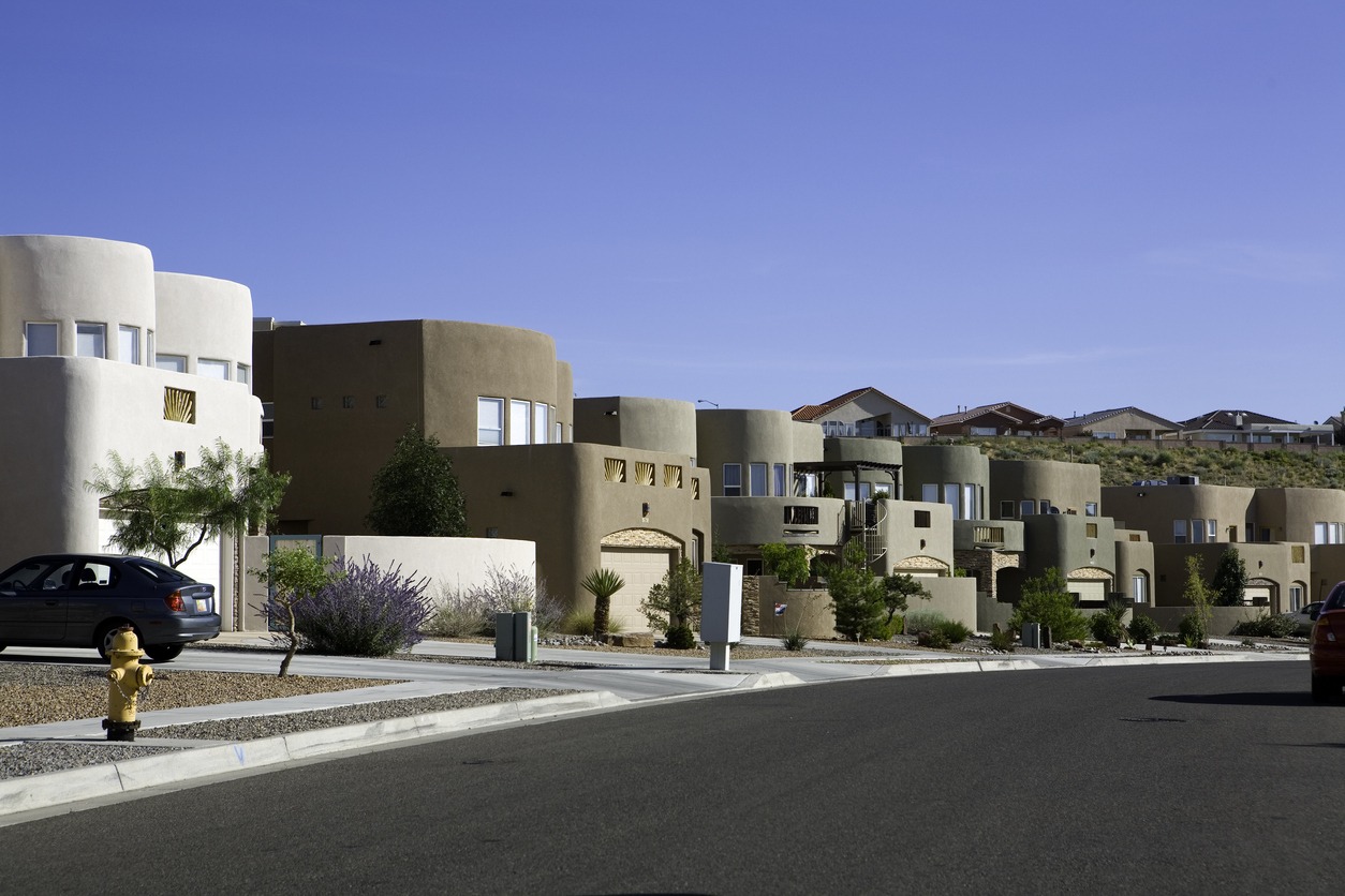 a neighborhood with modern adobe homes