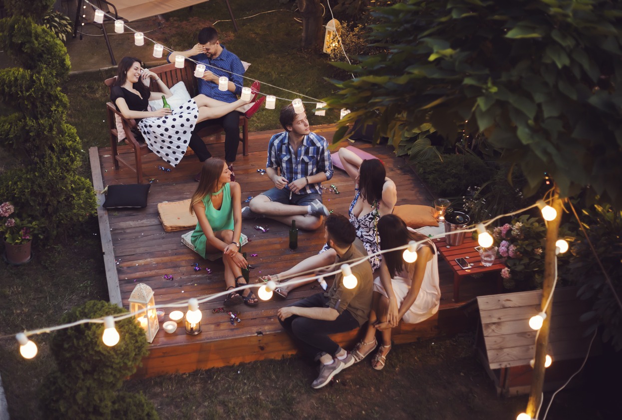 young people having a party in a backyard
