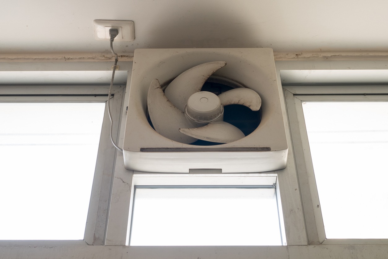 Exhaust fan and windows in a garage area