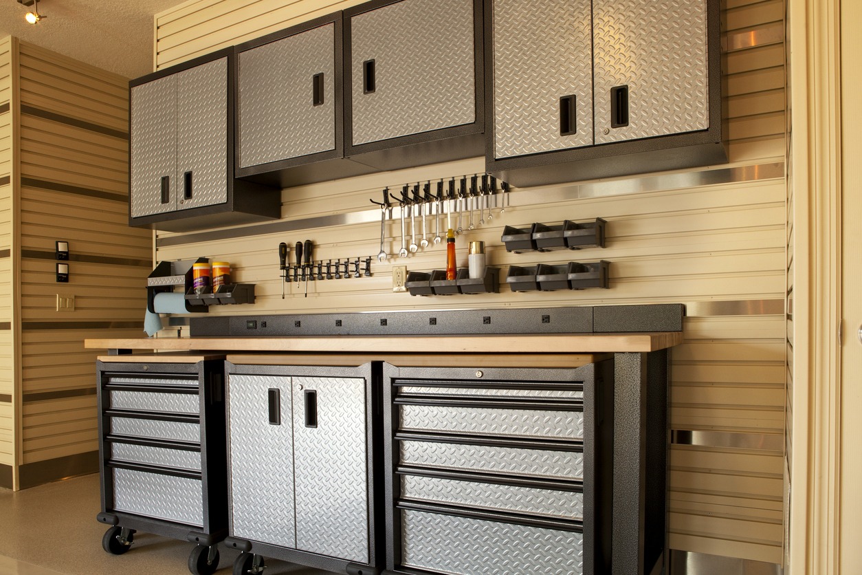 Garage workspace with cabinets, countertop and tools