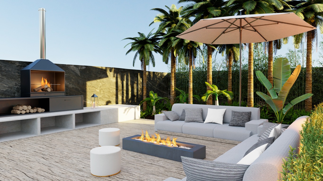 deck couch with cushions and barbecue surrounded by tropical garden