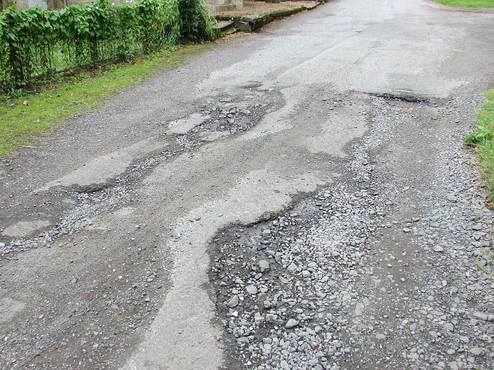 fill potholes in a gravel driveway